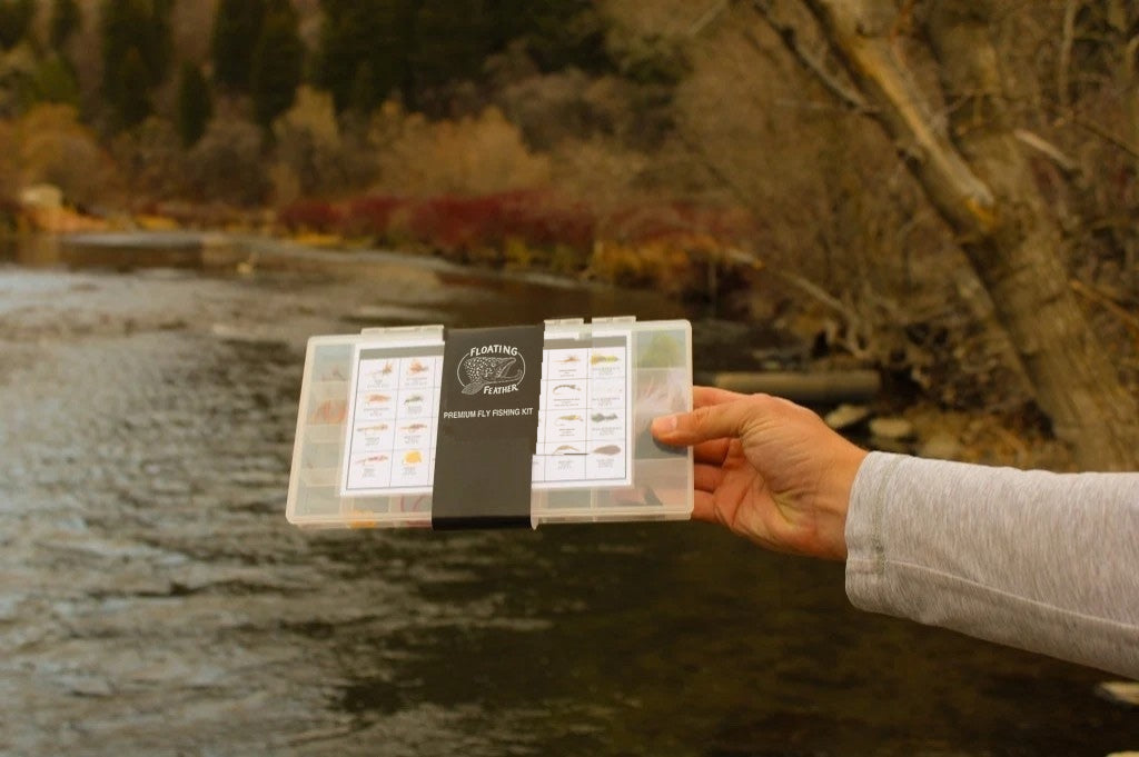 152-Piece Premium Fly Fishing Kit held by the river