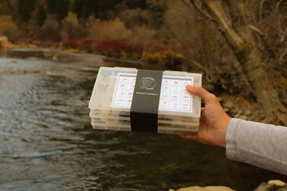 268-Piece Premium Fly Fishing Kit held by the river