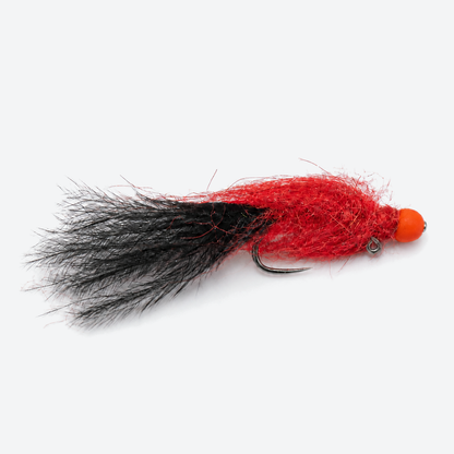 Egg sucking leech red fly on a pale studio background