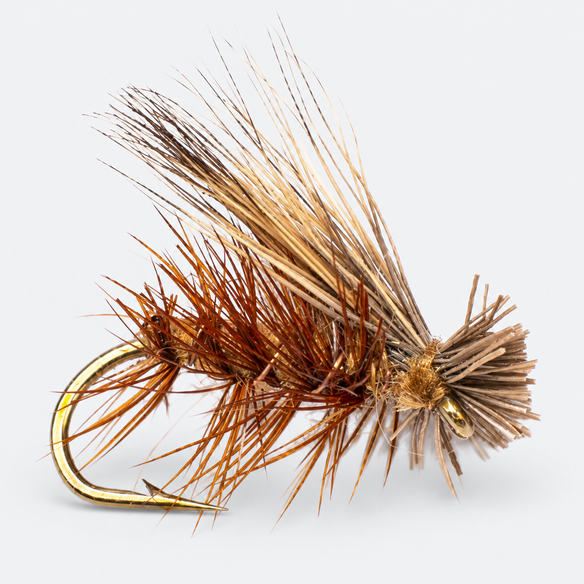 Tan Elk Hair Caddis single fly on a pale gray background