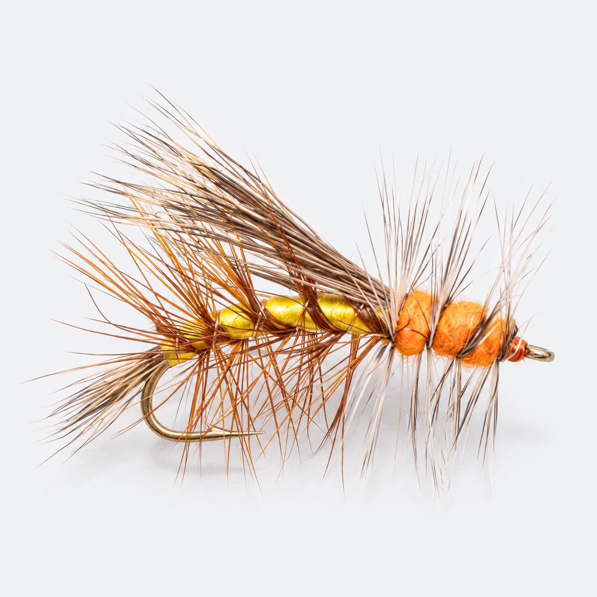 Yellow Stimulator single dry fly on a pale gray background
