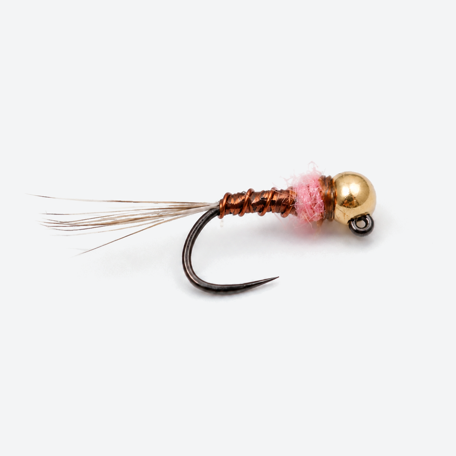 Thread Frenchie Jig single fly on a pale studio background