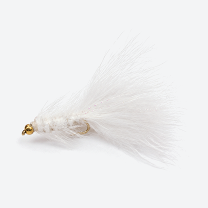 Woolly bugger white fly on a pale studio background