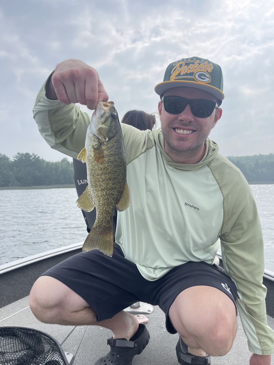 Two anglers with a trout at the lake