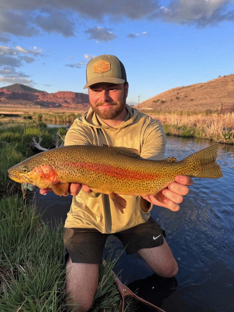 Angler with a catch on the river