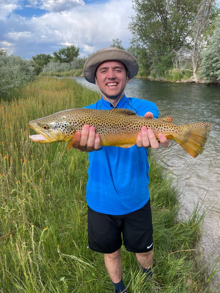 Angler with a catch on the river