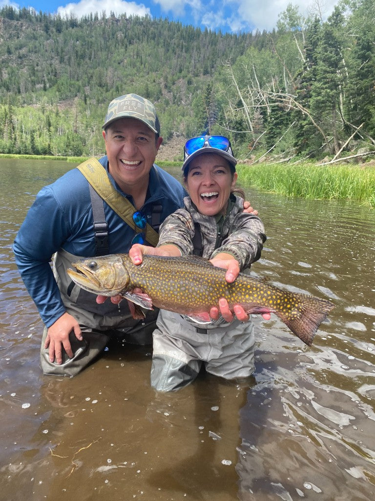 Angler with a catch on the river