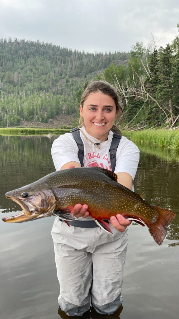 Angler with a catch on the river