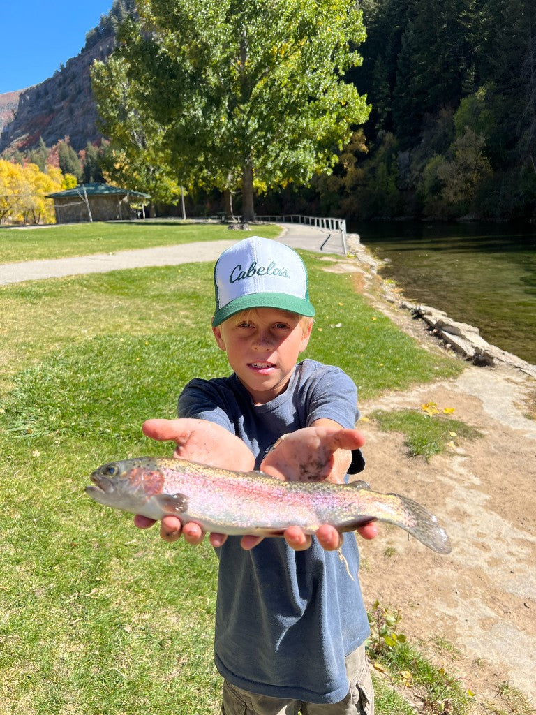Angler with a catch on the river